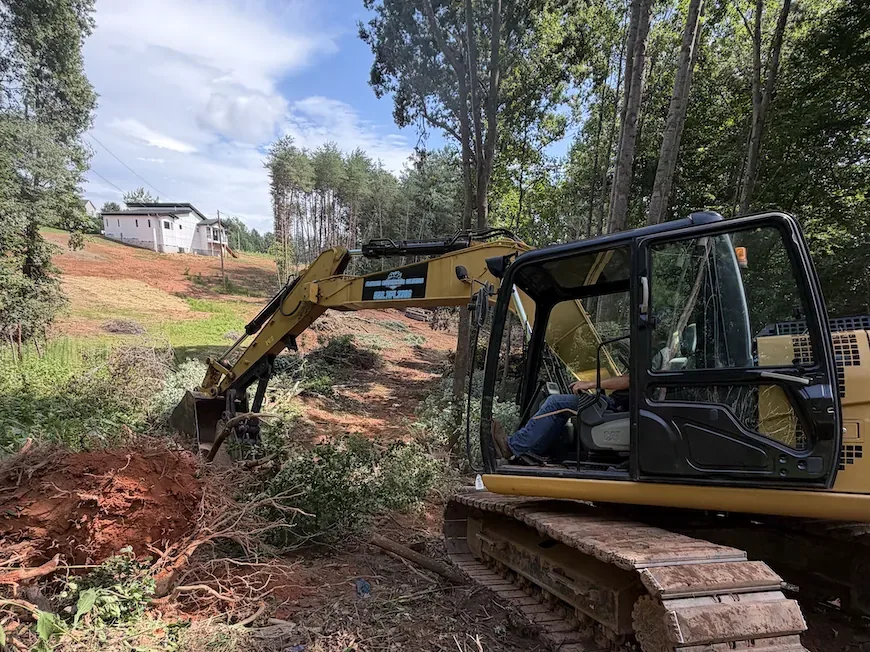 Brush and undergrowth being pulled off a residential lot &mdash; Little Acres Grading