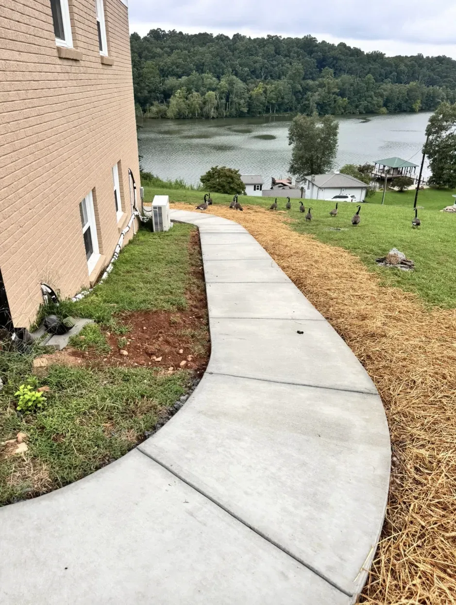 A concrete walkway poured to a side door &mdash; Little Acres Grading