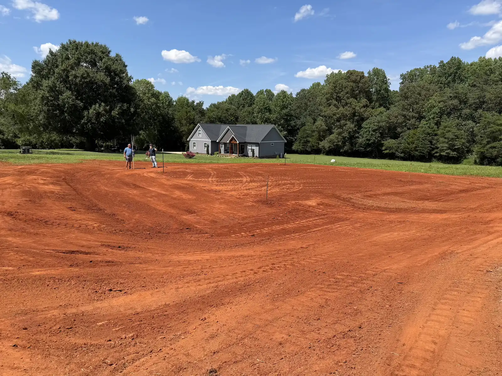 A large front lot shaped and graded in front of a new home — Little Acres Grading