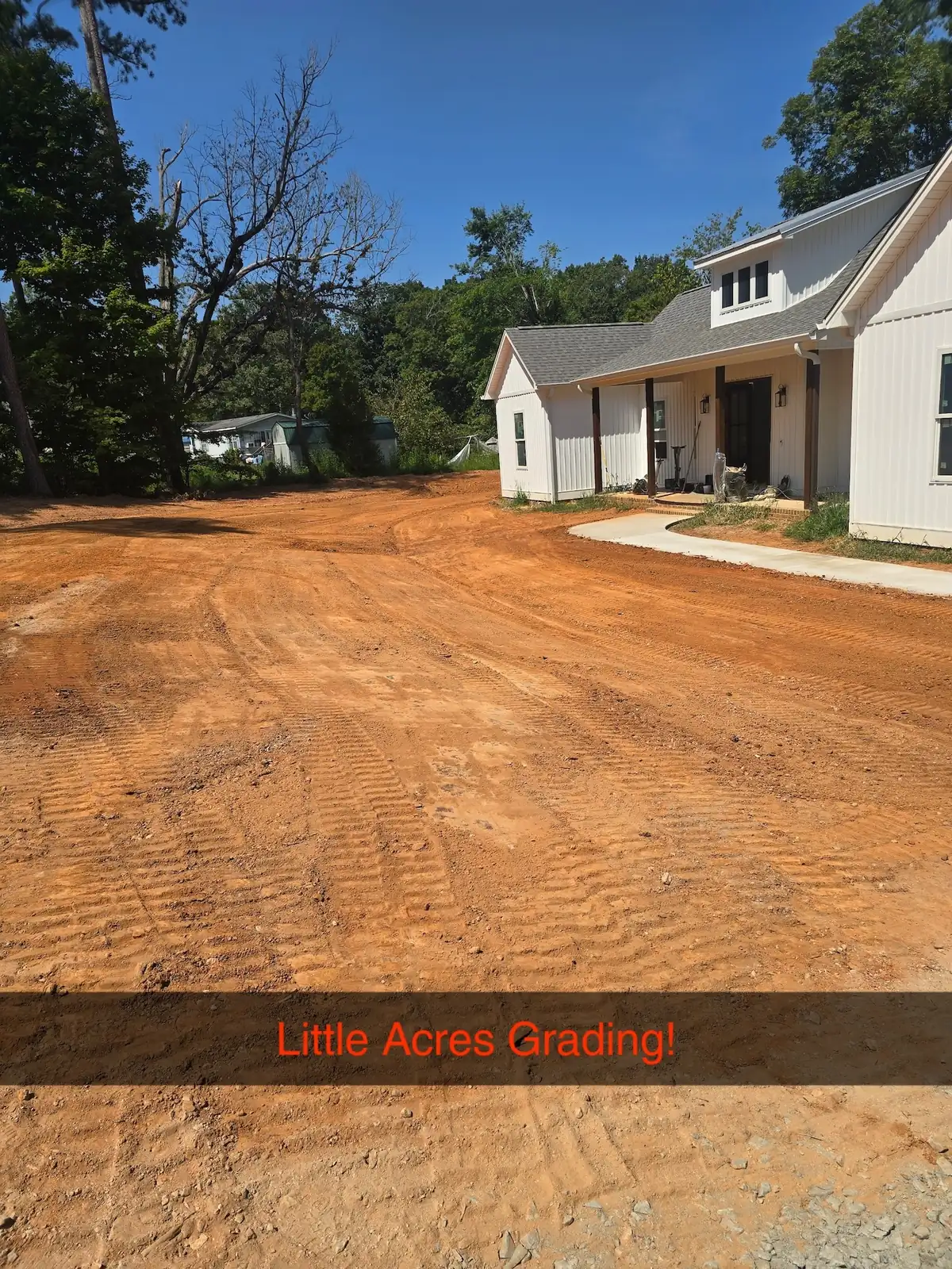 A yard cut and shaped to grade around a newly built farmhouse — Little Acres Grading